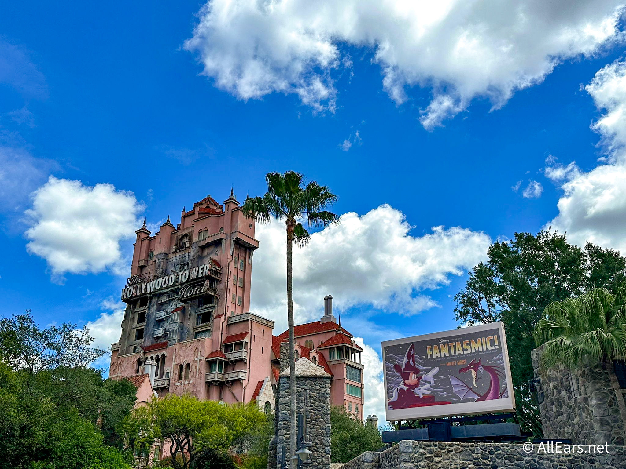 Twilight Zone Tower of Terror at Disney's Hollywood Studios with ominous clouds and a vintage hotel facade, capturing the ride's thrilling and suspenseful atmosphere