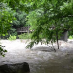 Chimney Rock Park's road damage caused by heavy rainfall, requiring stabilization.