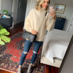Woman wearing an oversized turtleneck sweater with skinny jeans, creating a balanced silhouette
