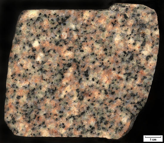 Granite rock with salmon pink potassium feldspar and white plagioclase crystals
