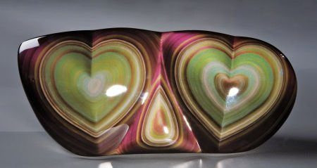 Rainbow obsidian sculpture with a double heart design