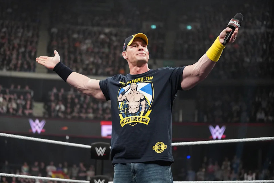 John Cena addresses the crowd during Monday Night RAW, showcasing his charisma and connection with fans.