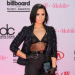 Demi Lovato at the 2016 Billboard Music Awards, reflecting on her journey through fame and addiction, showcasing the strength and resilience she has developed