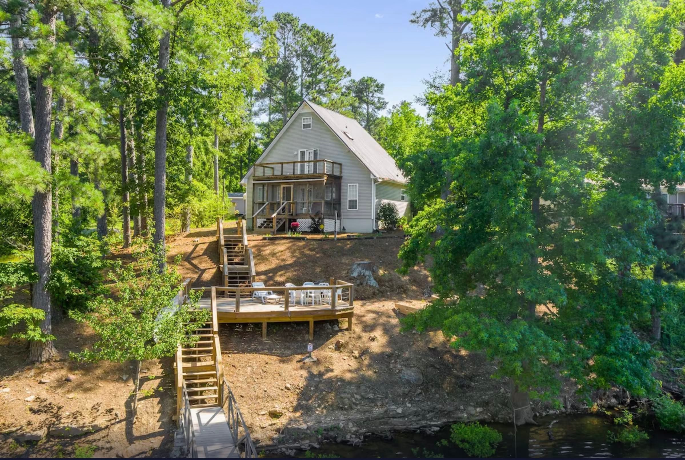 'A-Frame Of Mind' Home is nestled near a stunning lake and offers nature-based adventures with an on-site kayak near Rock The South.