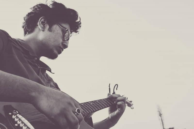 Musician passionately playing an electric guitar, capturing the essence of rock music and artistic expression
