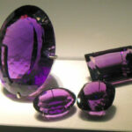 An amethyst crystal from Brazil faceted into gemstones for jewelry. Creative Commons License