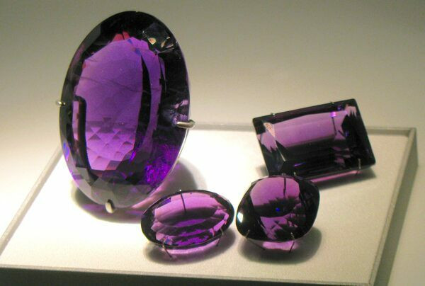 An amethyst crystal from Brazil faceted into gemstones for jewelry. Creative Commons License