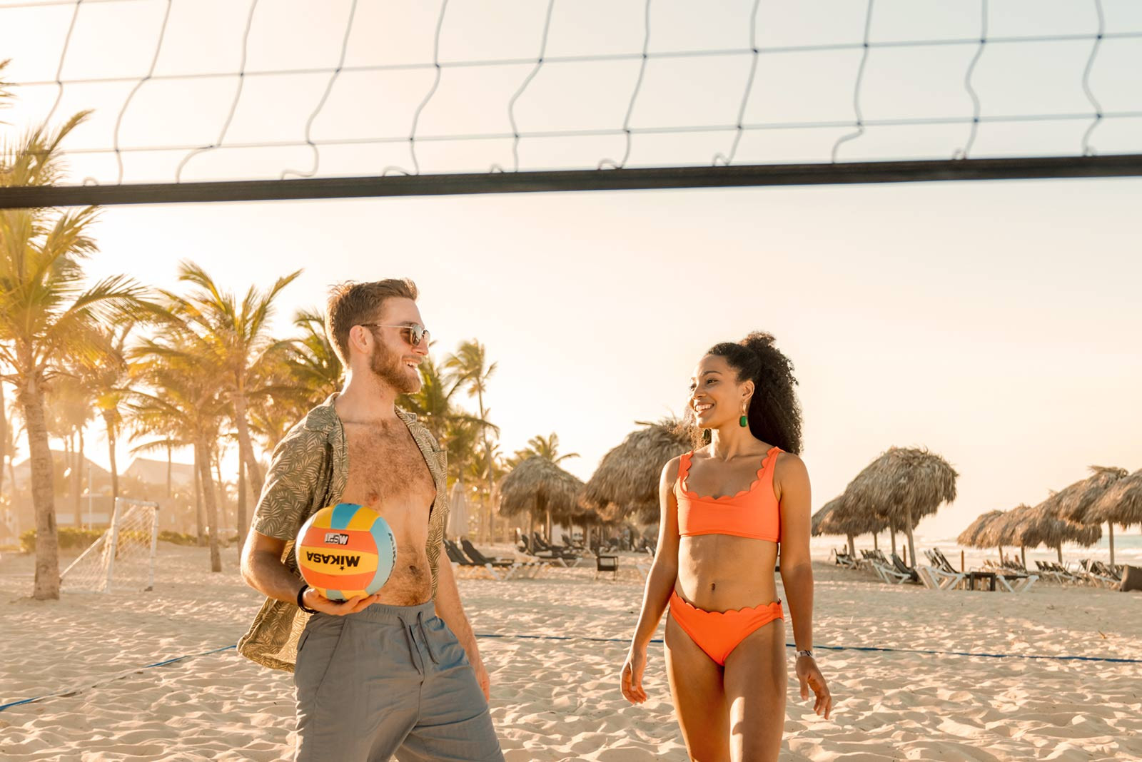 Hard Rock Punta Cana Beach Volleyball featuring guests enjoying a fun game on the beach, with the beautiful ocean in the background