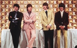 The Beatles in Tokyo, 1966, exemplifying their global impact and distinctive style.