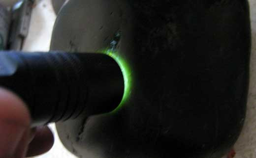 Black jade showing green tint under direct lighting