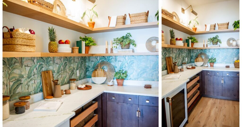 Walk-in pantry with open shelf storage and stylish wallpaper backsplash.