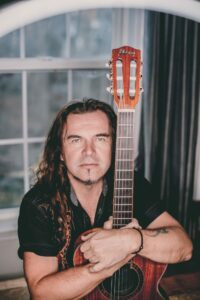 Zhenya Rock Performing with a Balalaika