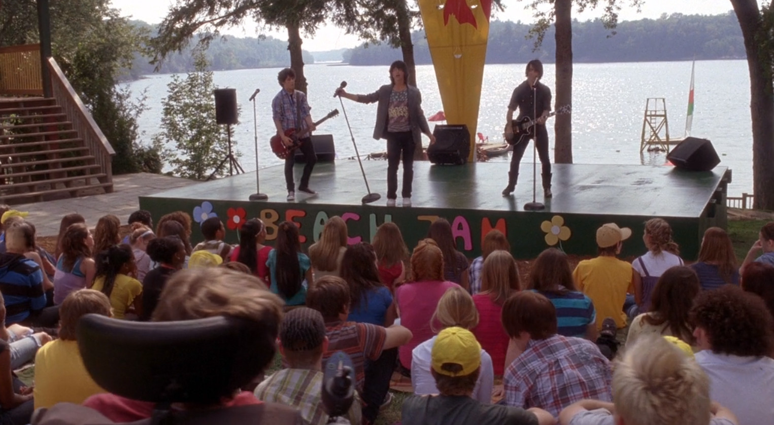 Jonas Brothers showing up to perform a song for everyone at the camp has nothing to do with the story