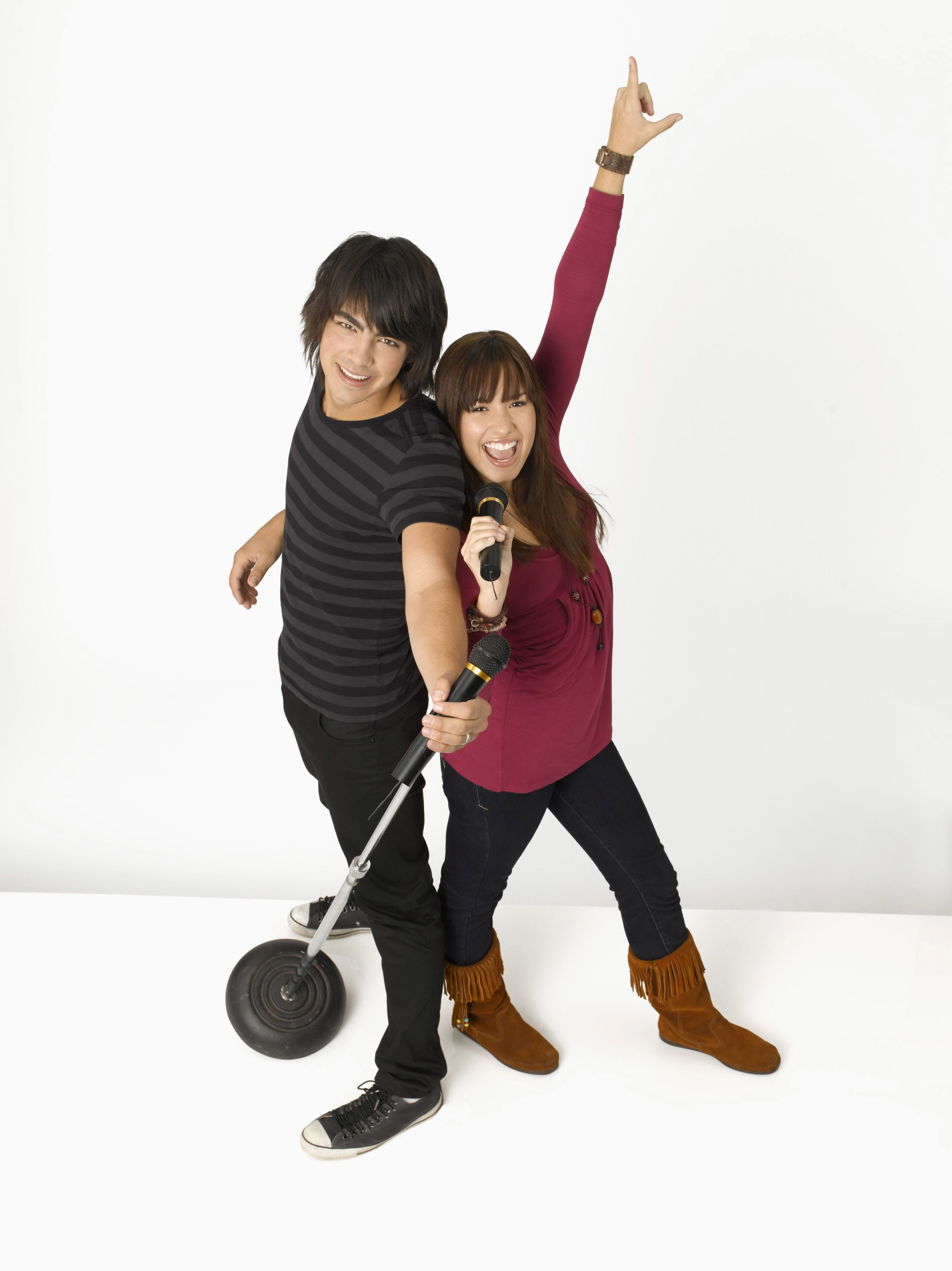 Demi Lovato and Joe Jonas sharing an almost-kiss in Camp Rock, capturing their on-screen chemistry
