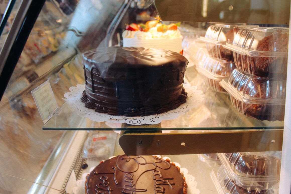 Rows of cakes at Community Bakery in Little Rock, offering a variety of sweet treats