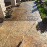 rocks being professionally cleaned with a power washer