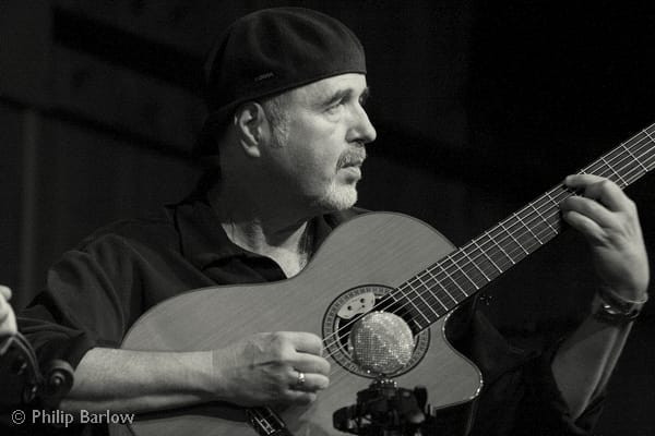 Denis Cahill Irish Guitar accompanying fiddle player Martin Hayes, is a fine example of a minimalist and beautiful player, allowing the melody to sing