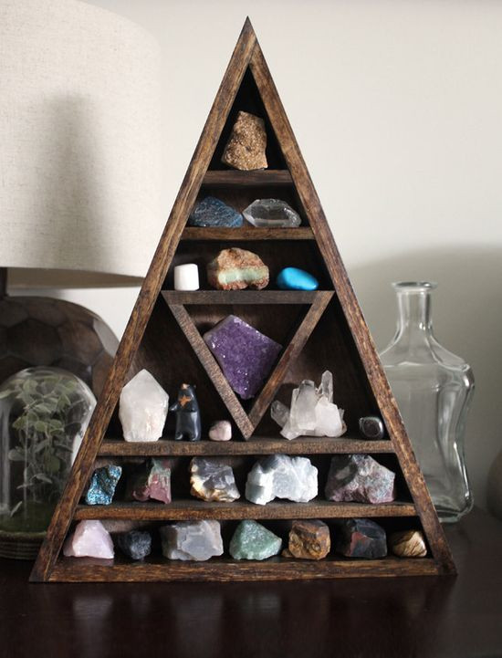 Minerals displayed on floating shelves with strategic lighting