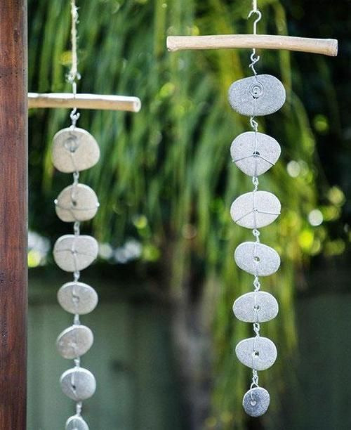 Three-dimensional art featuring hanging rocks, creating a sculptural display