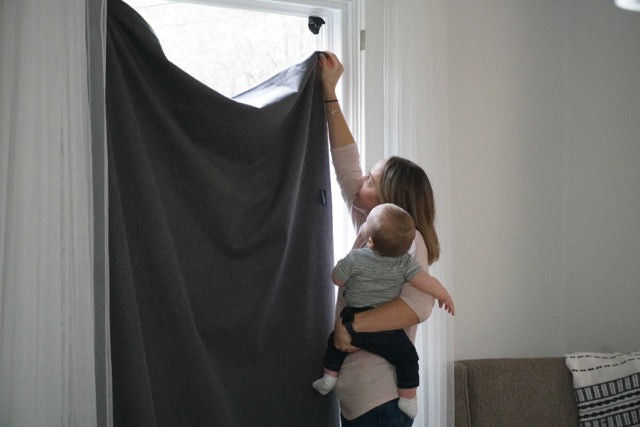 Mother setting up Sleepout curtains