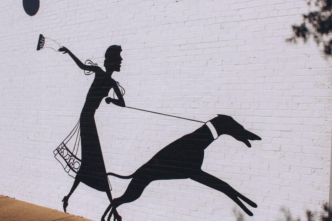 Mural on the side of the ESSE Purse Museum, adding to its artistic charm