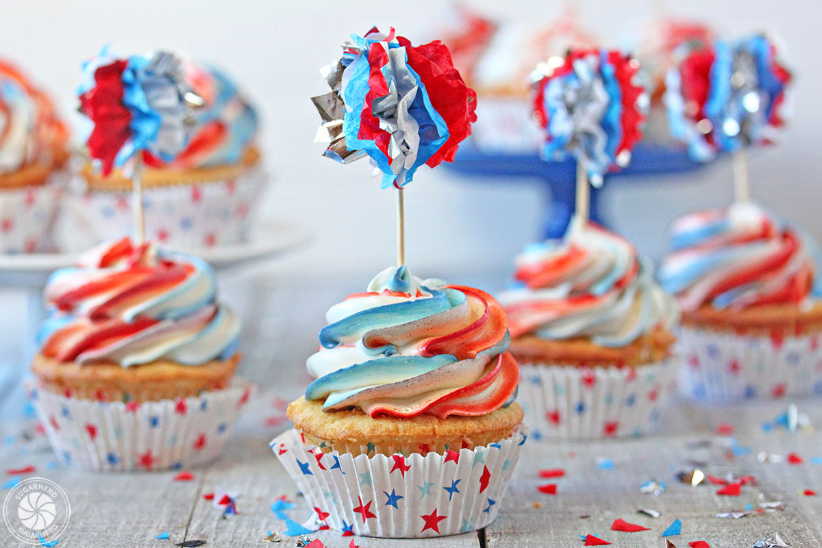 A close-up of Pop Rocks being sprinkled onto a frosted cake, capturing the moment of addition and the potential for immediate popping.