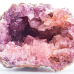 Geode exterior with a rough, bumpy texture, embedded in sedimentary rock, showcasing potential geode identification clues.