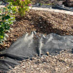 Gravel over landscape fabric