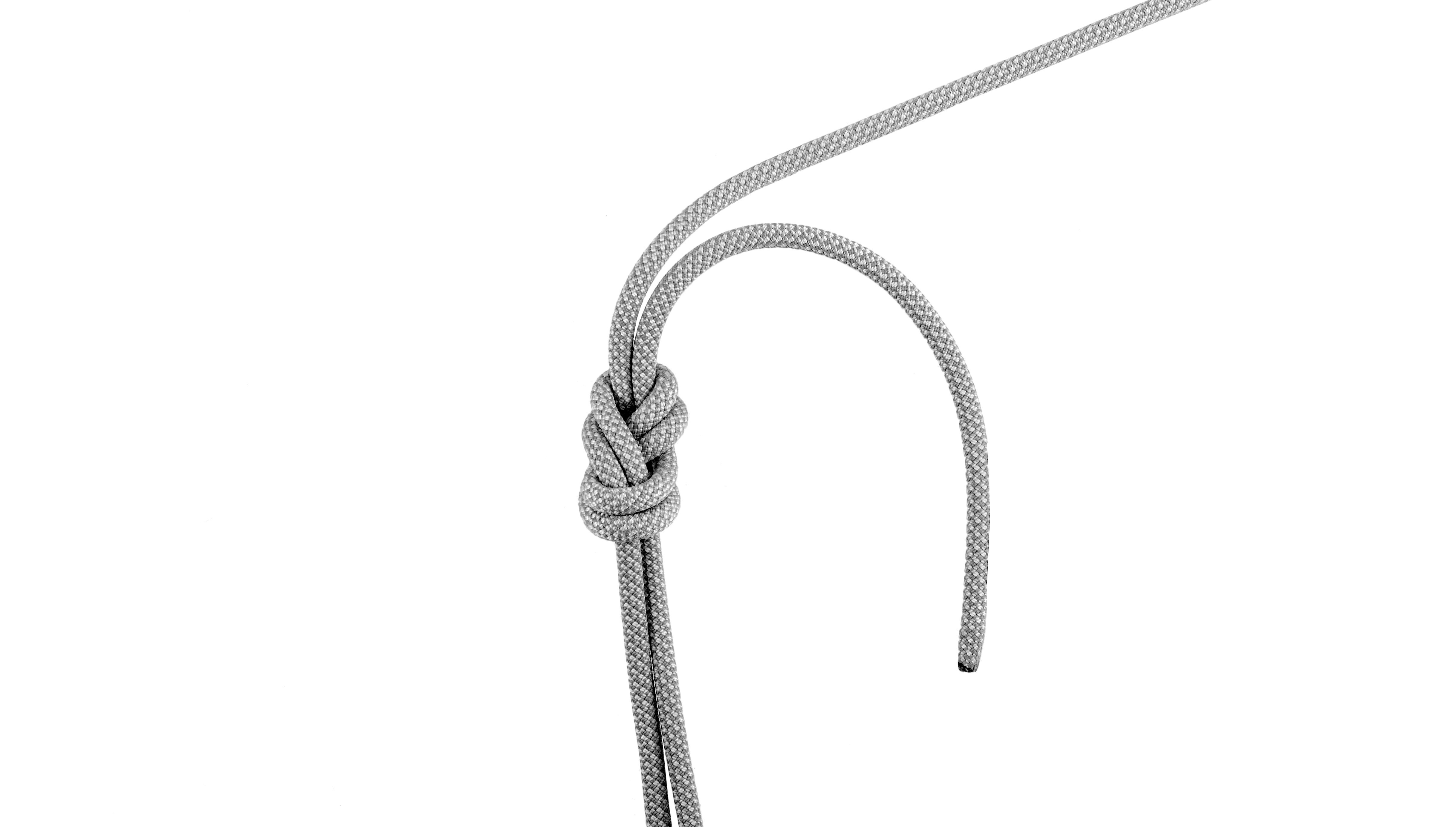 Checking knot for safety before rock climbing