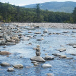 Balanced rock cairn on a beach