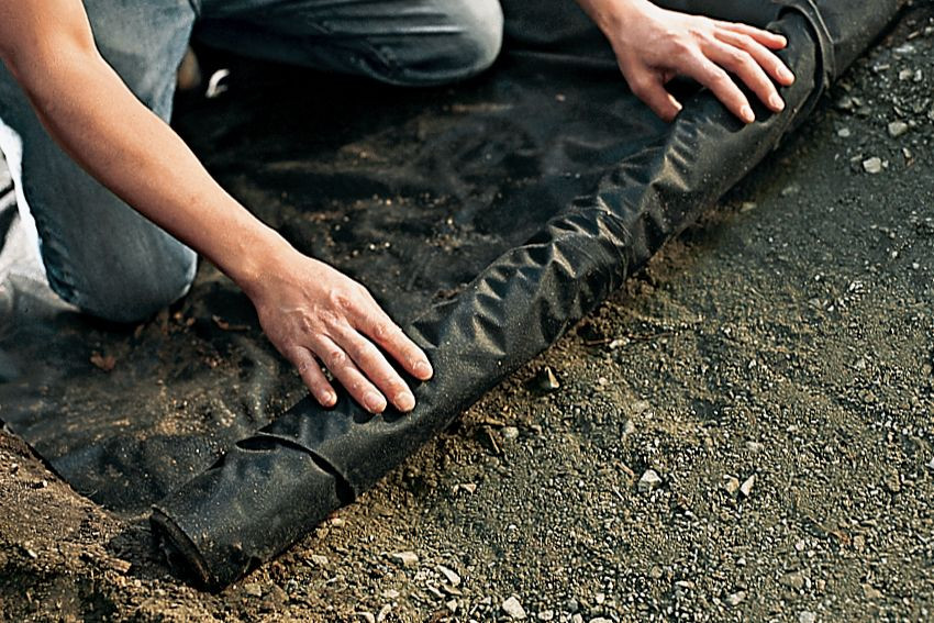 Laying down the landscape fabric
