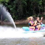 Dan Nicholas Park offers a variety of activities, including camping, a lake, carousel, train rides, a gem mine, an aquarium, a nature center, and animal habitats