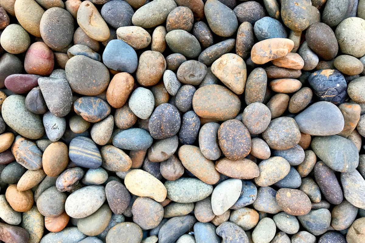 Multi colored rounded river rocks for landscaping