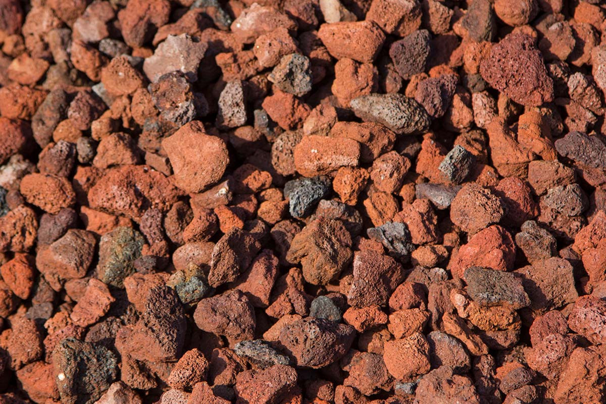 Red lava rock adds a vibrant touch to landscaping