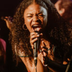 Female vocalist rocking on stage