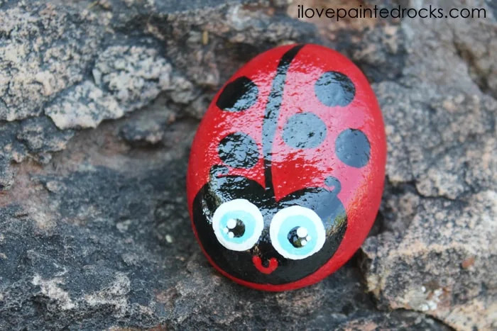 Ladybug painted rock ideas with various colors and spot patterns