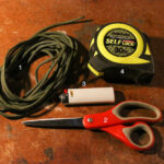 Paracord,measurement tape,scissor and a lighter for rock throwing sling.