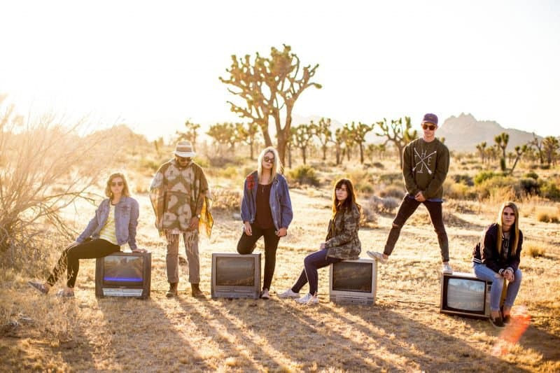Band photo in a desert setting, showcasing the visual identity and aesthetic of a rock group