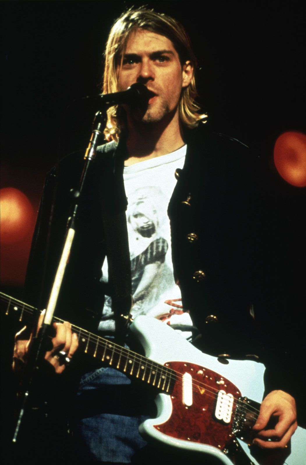 Kurt Cobain's intense performance during Nirvana's peak showcases the raw emotion and energy of their alternative rock sound