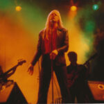 Larry Norman performing, a key figure in the emergence of Christian Rock