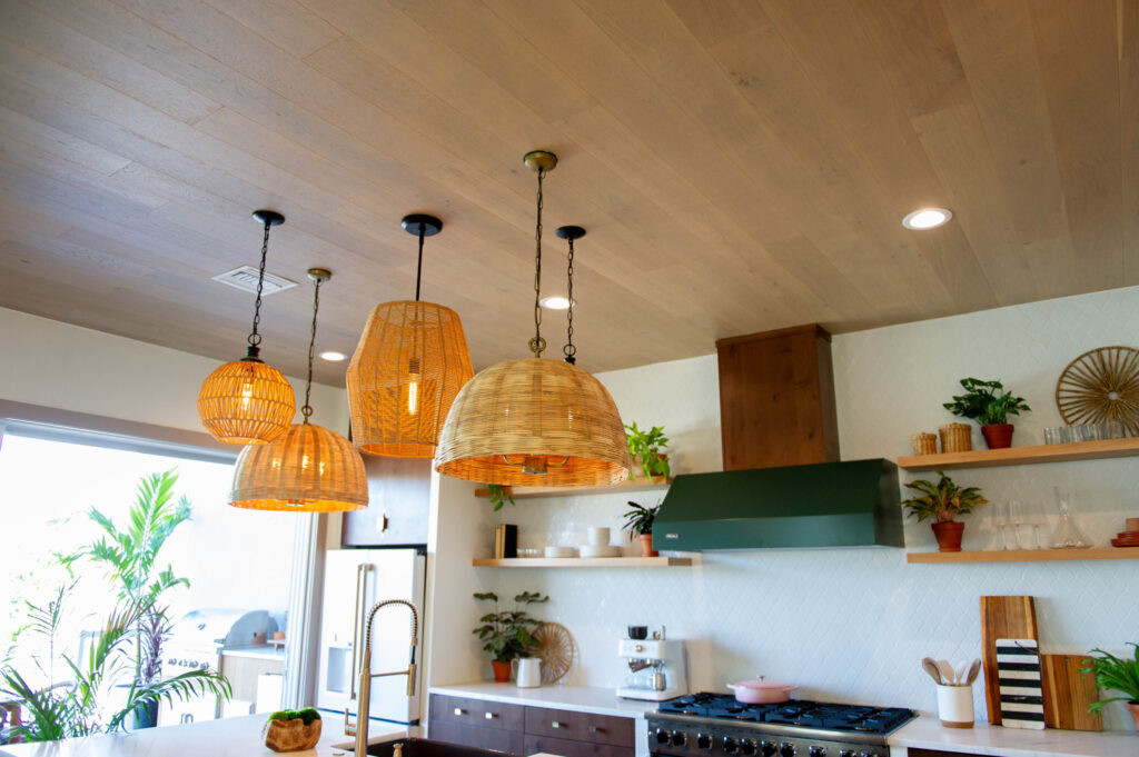 Close-up of the engineered hardwood flooring on the ceiling, adding coastal charm to the Rock the Block kitchen.