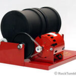 Rotary rock tumbler, showcasing a Thumler's A-R2 with two three-pound barrels, commonly used for transforming rough rocks into polished stones.