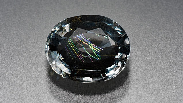 Musgravite gemstone, illustrating its varying proportions of magnesium, iron, and zinc within its aluminum oxide structure.