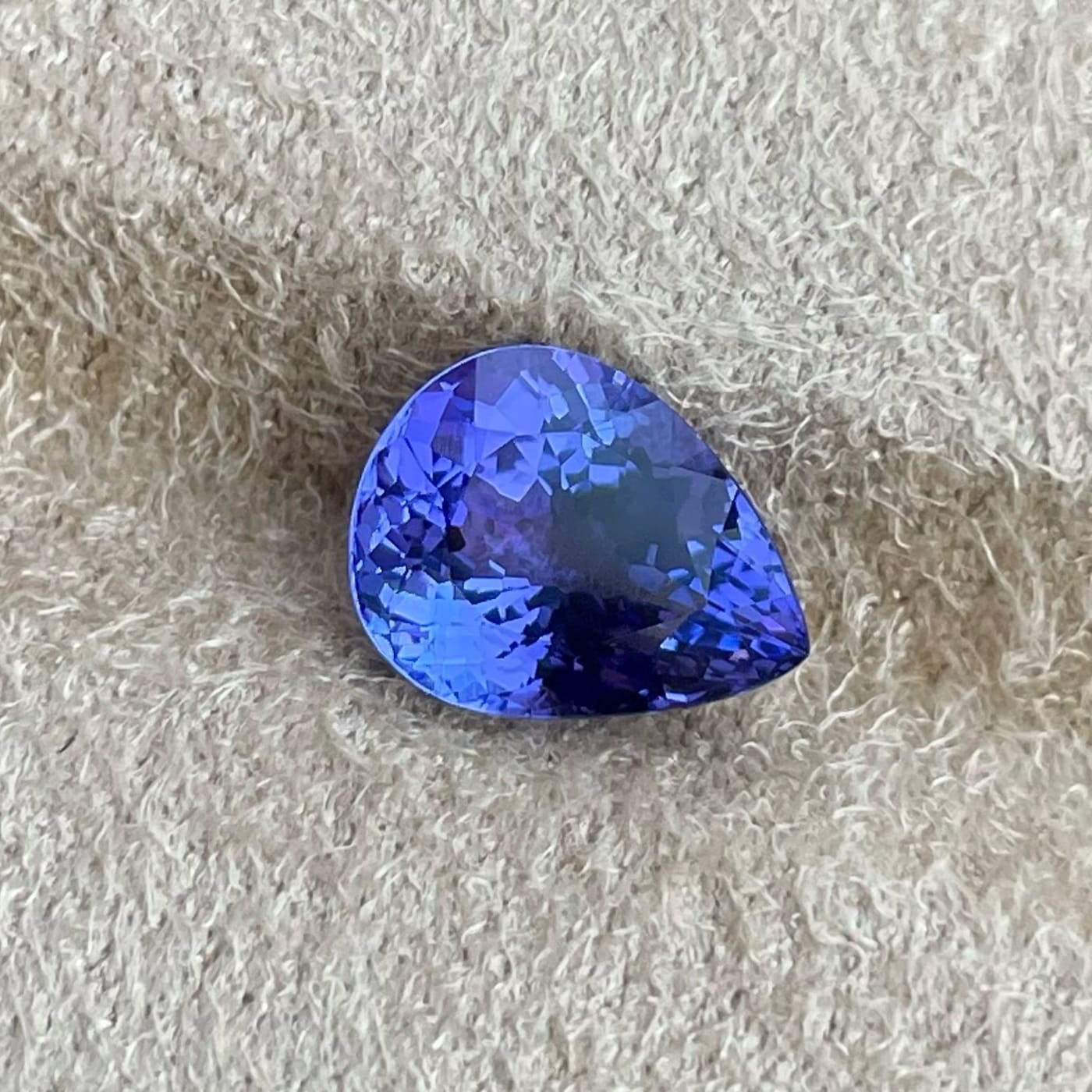 Tanzanite gemstone, showcasing its blue color and exclusive origin in northern Tanzania, making it rarer than diamonds.