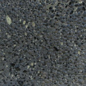 Green olivine phenocrysts and vesicles in basalt.