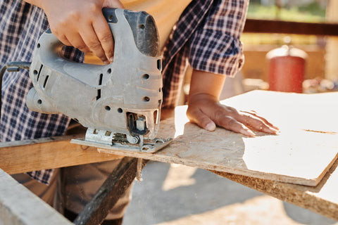 Man holding elliptical during workout, emphasizes the importance of stable base like plywood for balance.