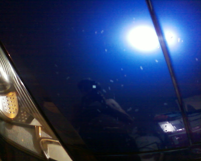 Applying touch up paint to rock chips with a brush