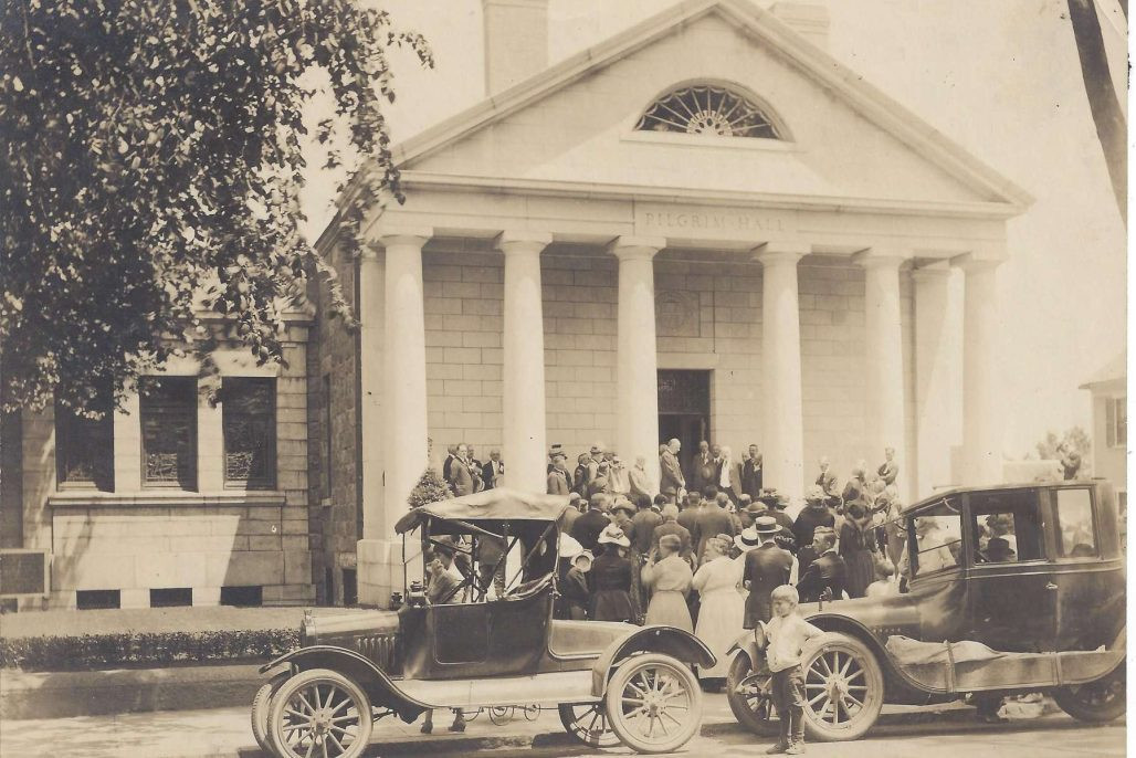 Pilgrim Hall Museum, the oldest continuously operating museum in the U.S., once housed Plymouth Rock, offering a rich collection of Pilgrim artifacts and historical insights