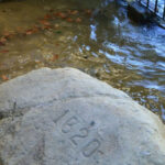 Plymouth Rock at Pilgrim Memorial State Park, protected by a granite canopy, ensuring its preservation and allowing visitors to reflect on its historical significance