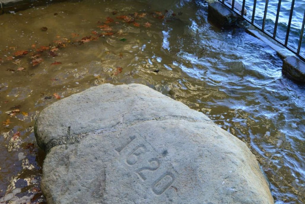 Plymouth Rock at Pilgrim Memorial State Park, protected by a granite canopy, ensuring its preservation and allowing visitors to reflect on its historical significance